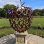 The sculpture in Wychwood Park in the orchard planted to mark HM The Queen's Platinum Jubilee in 2022